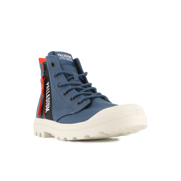 Front angle of Palladium Pampa Hi Outzip Overlab in Mood Indigo with rugged white sole and industrial side zip detail.