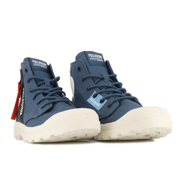Palladium Pampa Hi Outzip Overlab boots in Mood Indigo shown as a pair, highlighting side zip, bold logos, and adventure-ready design.