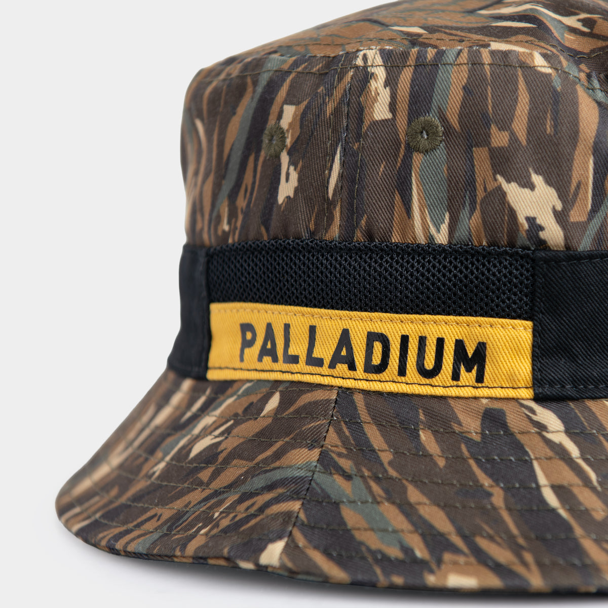 Palladium Vintage Bucket Hat Khaki - Close-Up of Yellow Palladium Logo Badge and Black Mesh Band