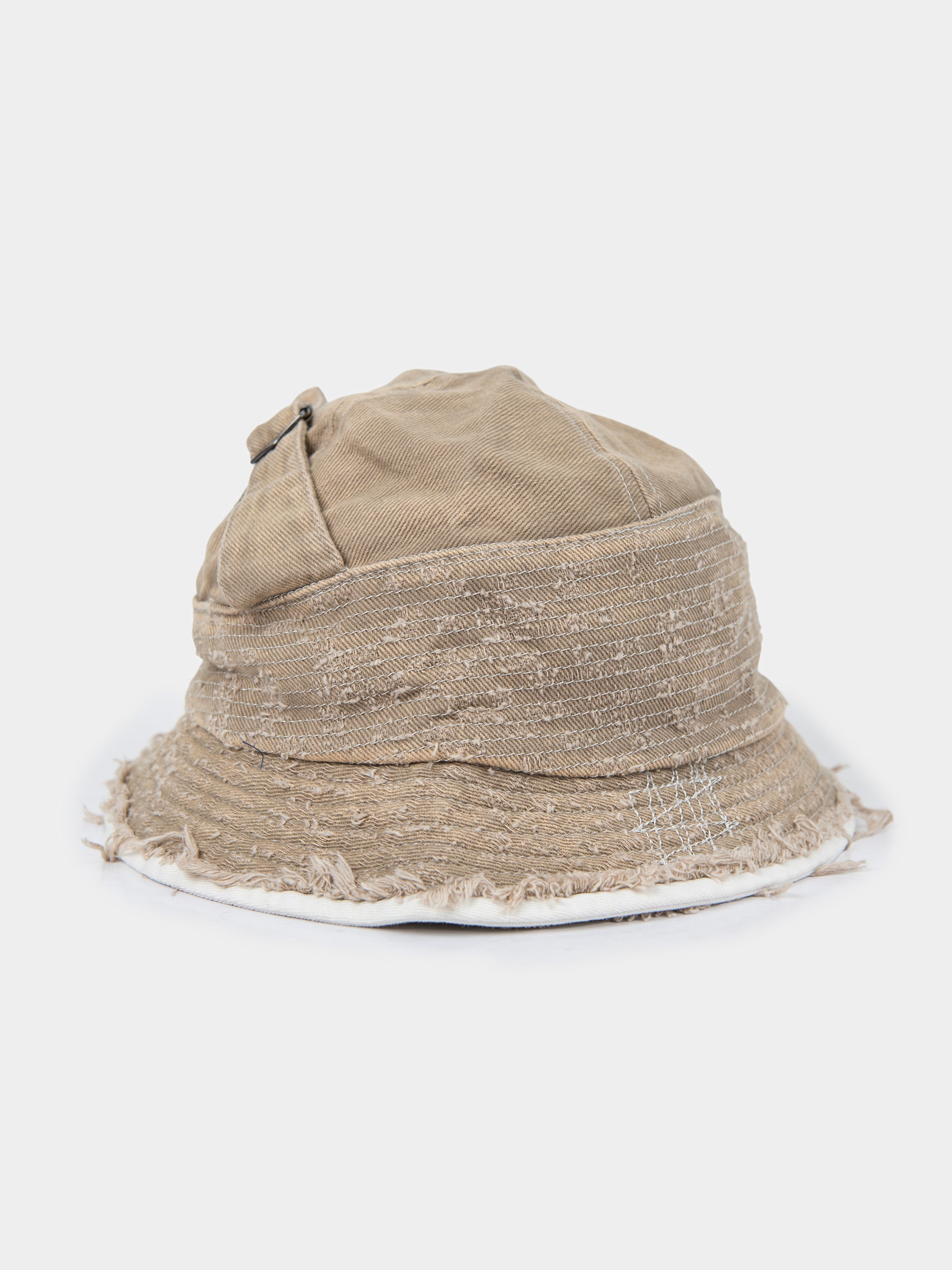 Palladium Frayed Bucket Hat in Stone beige distressed canvas, back view showing adjustable buckle strap