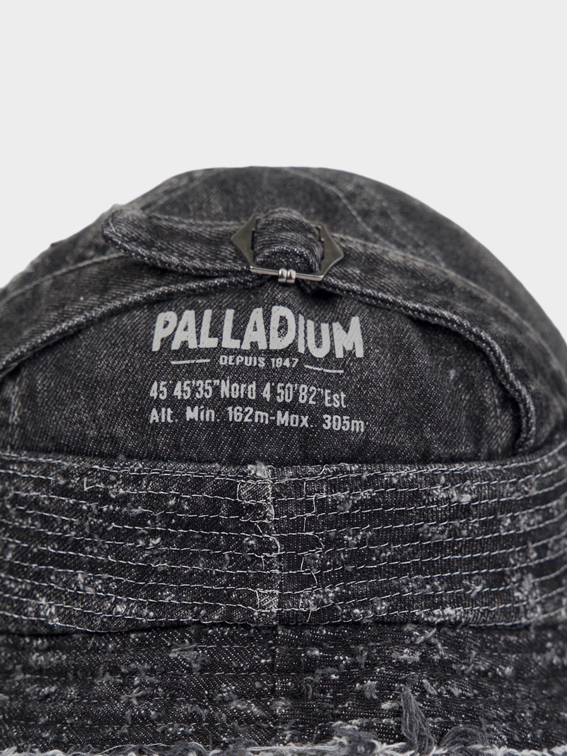 Palladium Frayed Bucket Hat in Black - back detail view with adjustable buckle and Palladium branding